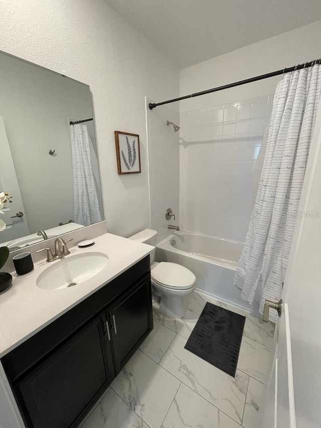 full bathroom featuring toilet, marble finish floor, shower / bath combo with shower curtain, and vanity