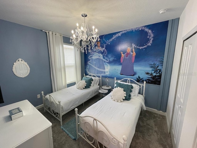 carpeted bedroom featuring a chandelier, a textured ceiling, and baseboards