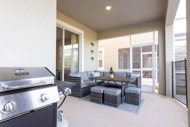 view of patio with area for grilling and an outdoor hangout area