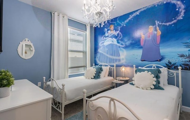 bedroom featuring baseboards, carpet floors, and a notable chandelier