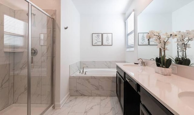 full bathroom featuring a sink, marble finish floor, a shower stall, a bath, and double vanity