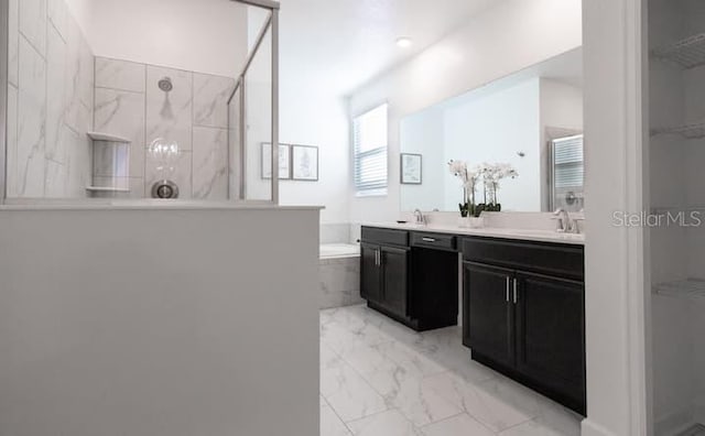 full bathroom featuring double vanity, a marble finish shower, a bath, marble finish floor, and a sink