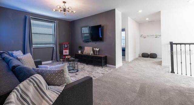 carpeted living room featuring baseboards and a notable chandelier