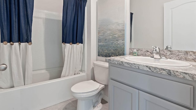 bathroom with shower / bath combo with shower curtain, vanity, toilet, and tile patterned floors