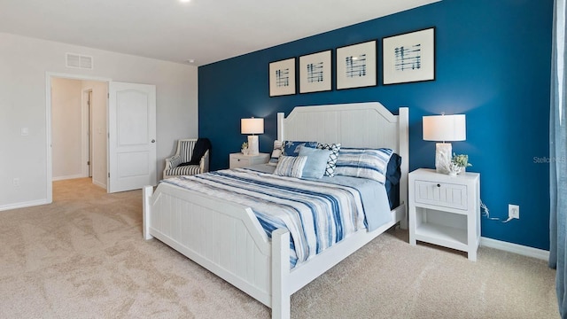 bedroom featuring light carpet, baseboards, and visible vents