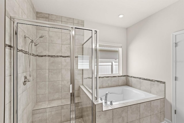 full bath featuring a shower stall and a bath