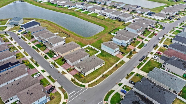 birds eye view of property featuring a residential view and a water view