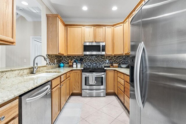 13221 Fountainbleau Dr, Clermont, FL 34711 - kitchen with stainless steel appliances, ornamental molding, light tile patterned floors, decorative backsplash, and light stone countertops