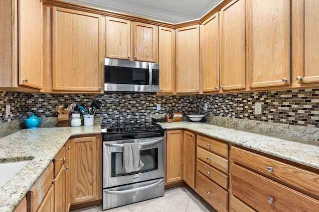 13221 Fountainbleau Dr, Clermont, FL 34711 - kitchen featuring stainless steel appliances, light tile patterned floors, tasteful backsplash, and light stone countertops