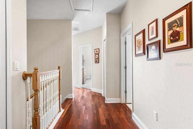 13221 Fountainbleau Dr, Clermont, FL 34711 - hall with an upstairs landing, attic access, and dark wood-type flooring