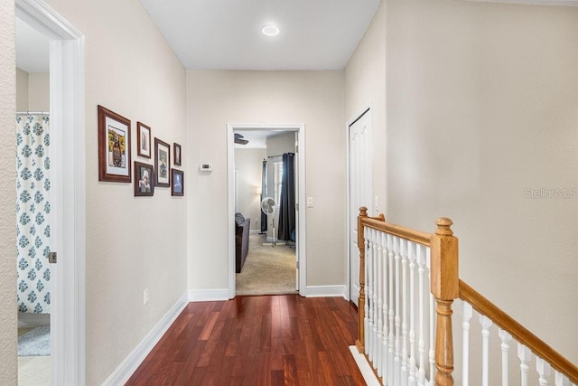 13221 Fountainbleau Dr, Clermont, FL 34711 - hallway with an upstairs landing and dark wood-type flooring