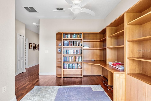 13221 Fountainbleau Dr, Clermont, FL 34711 - office with built in study area, wood finished floors, and a ceiling fan