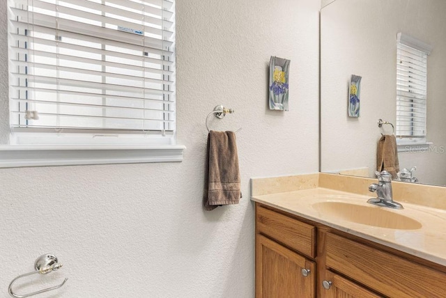 13221 Fountainbleau Dr, Clermont, FL 34711 - bathroom featuring vanity and a textured wall
