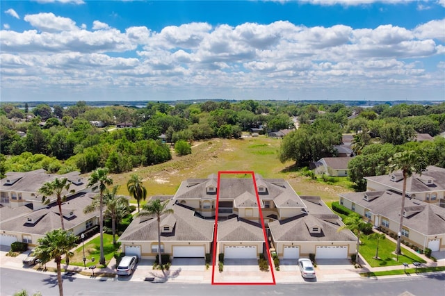 13221 Fountainbleau Dr, Clermont, FL 34711 - aerial view of residential area featuring property boundaries highlighted and a tree filled landscape