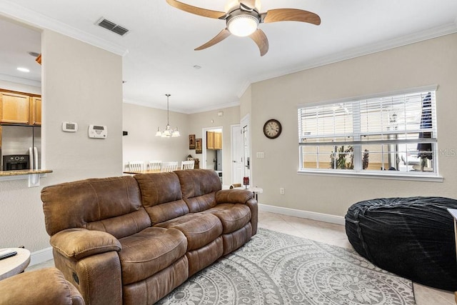 13221 Fountainbleau Dr, Clermont, FL 34711 - living room with light tile patterned floors, ceiling fan, a chandelier, and crown molding