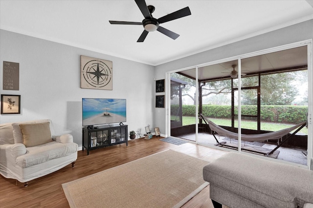 2851 Polvadero Ln Unit 107, Orlando, FL 32835 - living room with ceiling fan, ornamental molding, wood finished floors, and baseboards