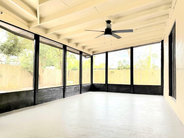 unfurnished sunroom featuring ceiling fan