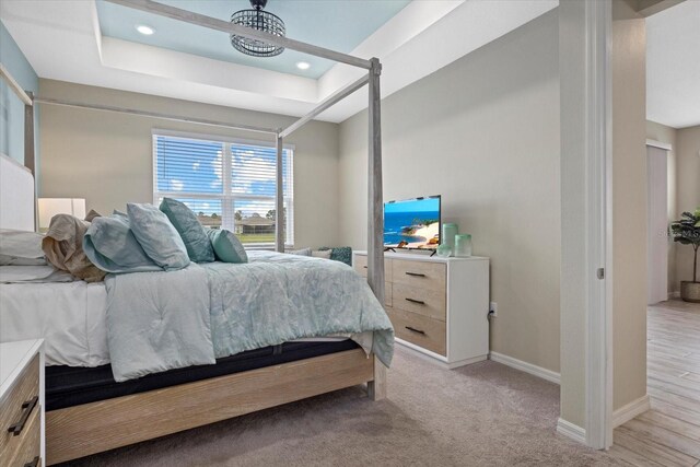 bedroom featuring recessed lighting, light carpet, and baseboards