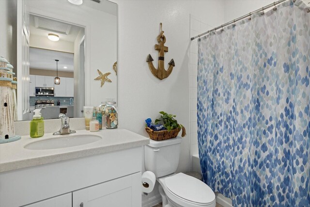 full bath featuring toilet and vanity