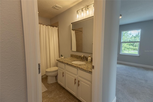 14664 Spotted Sandpiper Blvd, Winter Garden, FL 34787 - full bath with vanity, a shower with shower curtain, a textured ceiling, and tile patterned flooring