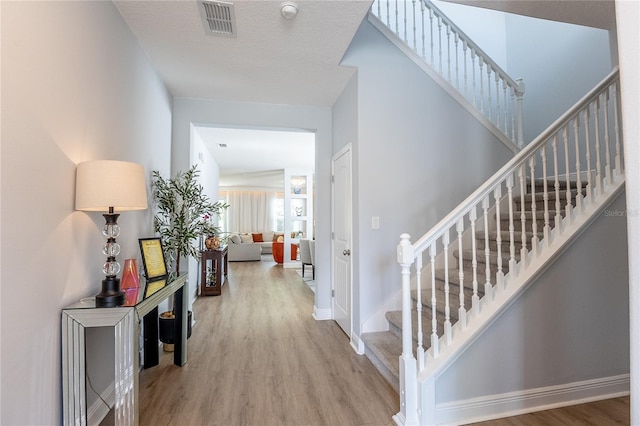 14664 Spotted Sandpiper Blvd, Winter Garden, FL 34787 - entrance foyer with wood finished floors and stairs