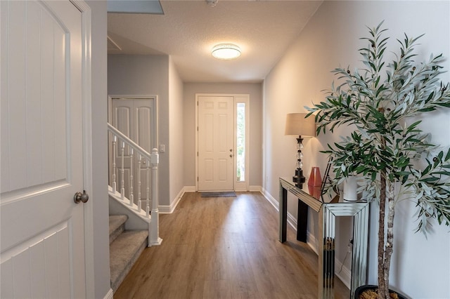 14664 Spotted Sandpiper Blvd, Winter Garden, FL 34787 - foyer entrance with wood finished floors and stairs
