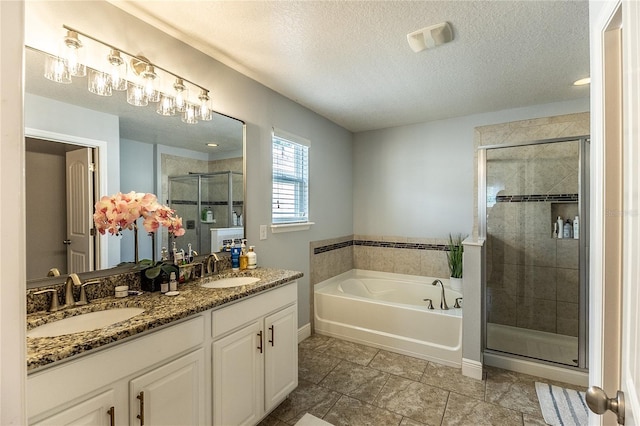 14664 Spotted Sandpiper Blvd, Winter Garden, FL 34787 - full bath featuring a shower stall, a bath, double vanity, and a textured ceiling