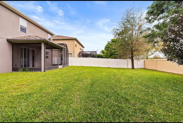 14664 Spotted Sandpiper Blvd, Winter Garden, FL 34787 - fenced backyard with a sunroom
