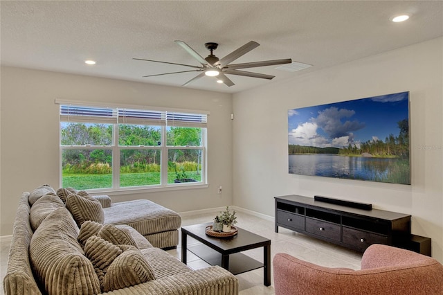 living room with recessed lighting, visible vents, ceiling fan, a textured ceiling, and baseboards