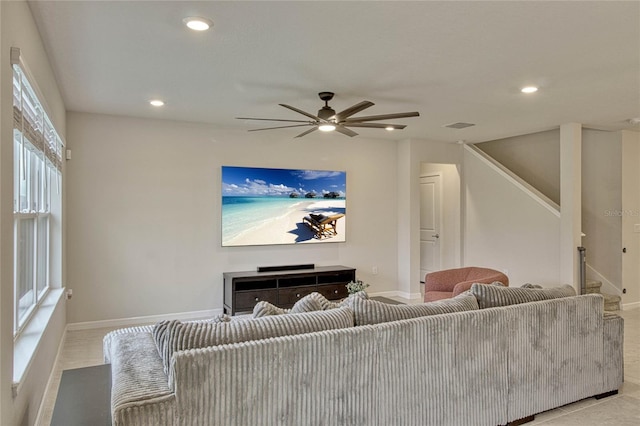 living area with baseboards, a fireplace, visible vents, and recessed lighting