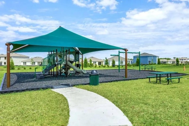 community jungle gym with a lawn
