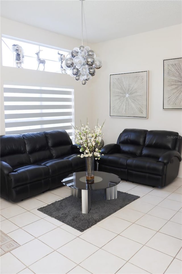 living area with a chandelier and light tile patterned flooring