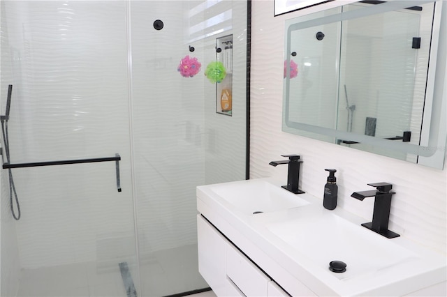 full bath featuring tasteful backsplash, a stall shower, vanity, and tile walls