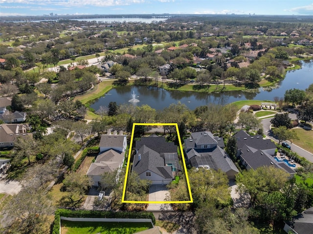 bird's eye view featuring a water view and a residential view