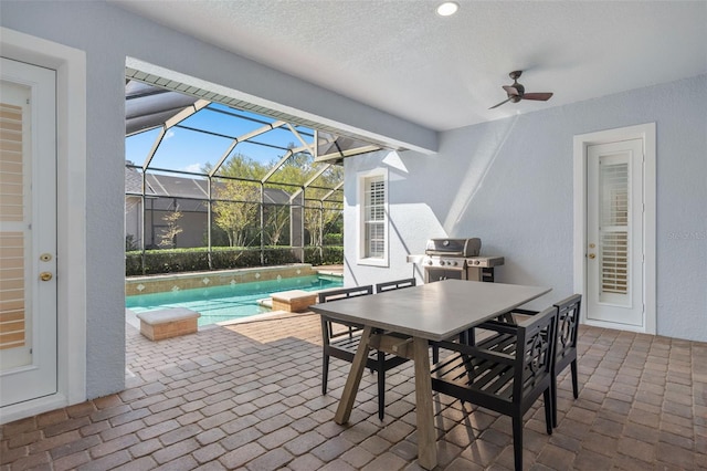 view of patio / terrace featuring outdoor dining space, glass enclosure, a grill, ceiling fan, and an outdoor pool