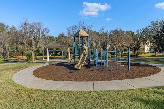 communal playground featuring a yard