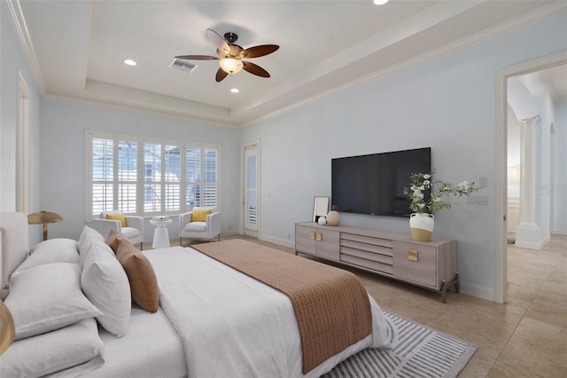 bedroom with baseboards, visible vents, a tray ceiling, crown molding, and light tile patterned flooring