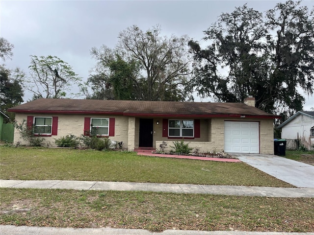 ranch-style home with brick siding, a chimney, concrete driveway, a front yard, and a garage