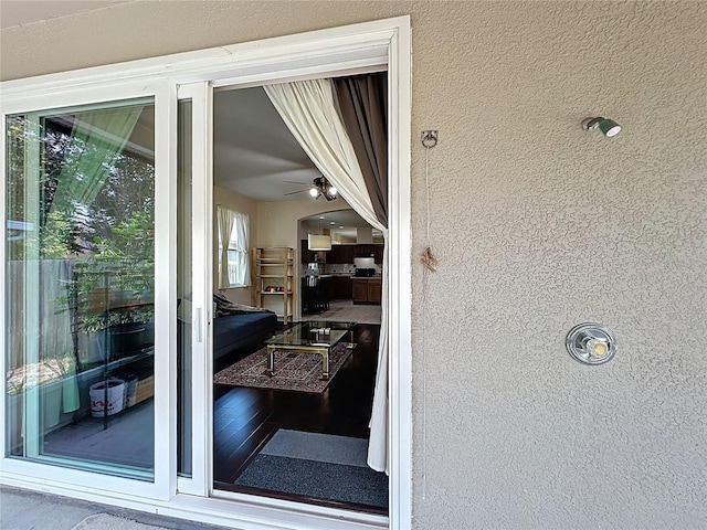 property entrance featuring stucco siding