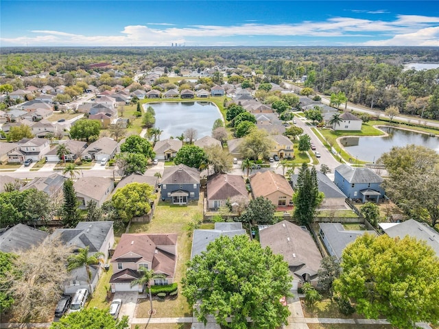 birds eye view of property with a residential view and a water view