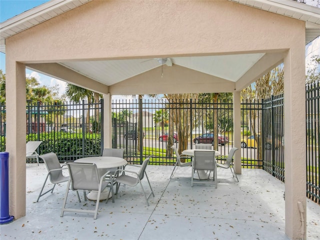 view of patio / terrace with outdoor dining space and fence