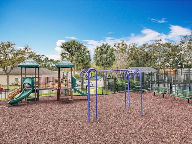 communal playground featuring fence