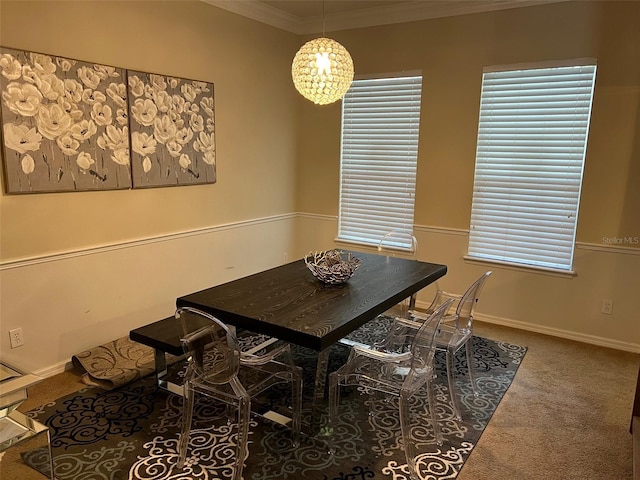 carpeted dining space with ornamental molding and baseboards