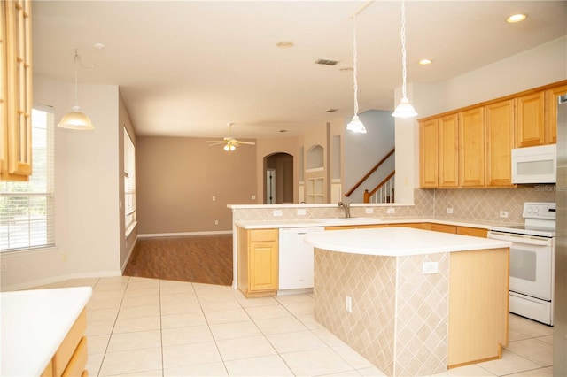 11474 Claymont Cir, Windermere, FL 34786 - kitchen featuring white appliances, light tile patterned floors, light countertops, decorative backsplash, and recessed lighting