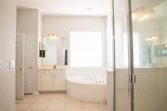 11474 Claymont Cir, Windermere, FL 34786 - full bathroom featuring a bath, vanity, tile patterned flooring, and a stall shower