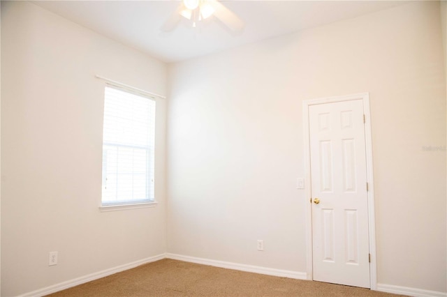 11474 Claymont Cir, Windermere, FL 34786 - unfurnished room with light colored carpet, ceiling fan, and plenty of natural light