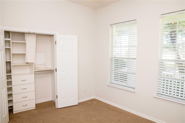 11474 Claymont Cir, Windermere, FL 34786 - unfurnished bedroom with light colored carpet and baseboards