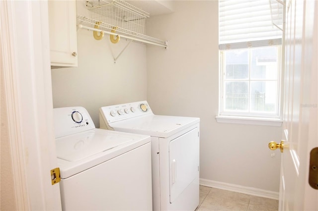 11474 Claymont Cir, Windermere, FL 34786 - washroom with washer and dryer, cabinet space, and light tile patterned floors