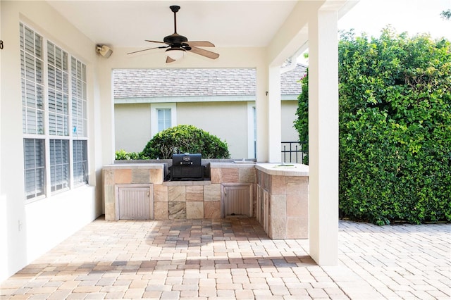 11474 Claymont Cir, Windermere, FL 34786 - view of patio with an outdoor kitchen and a ceiling fan