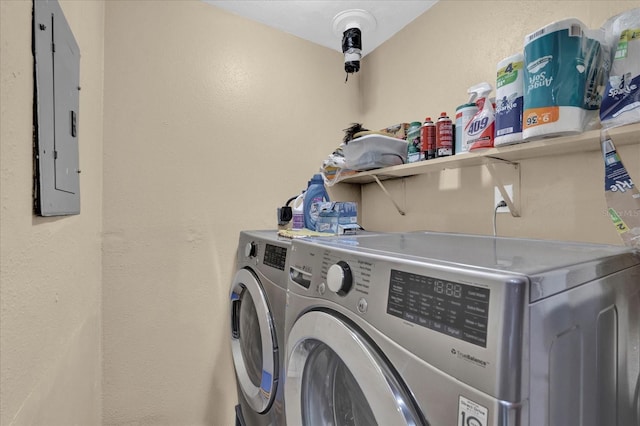 laundry room with laundry area, independent washer and dryer, and electric panel